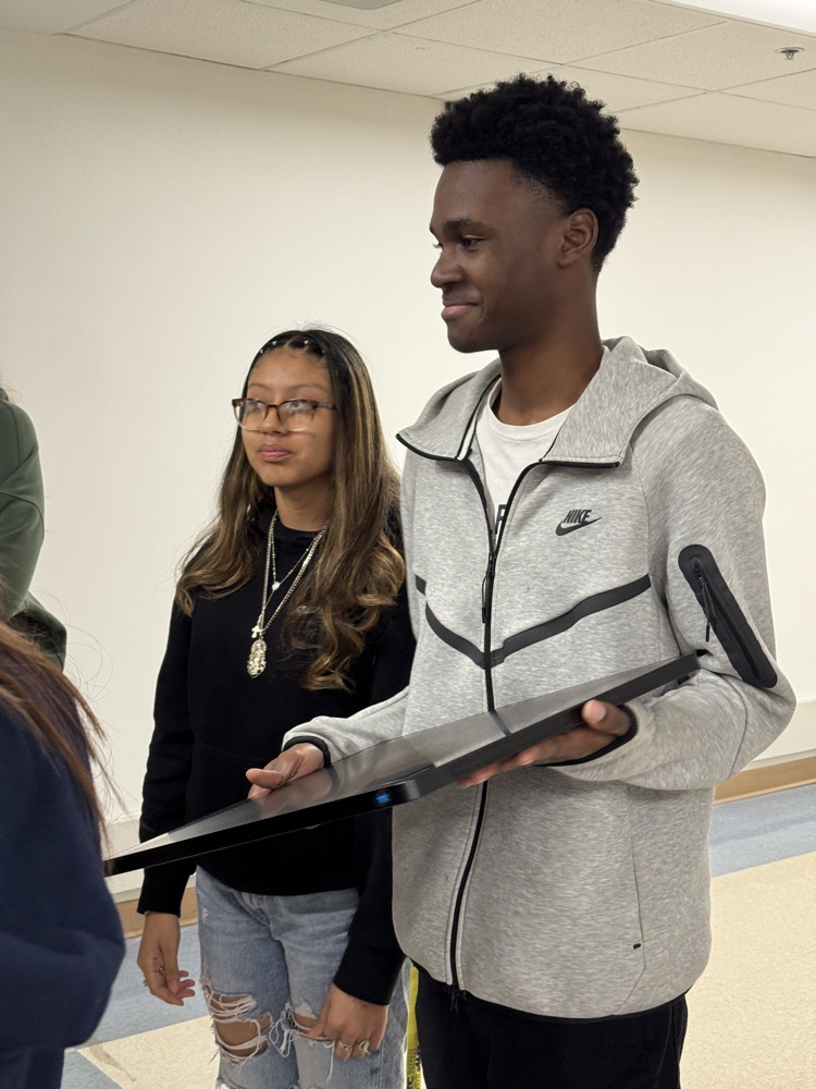 A student holds a piece of equipment that radiologist use in a hospital