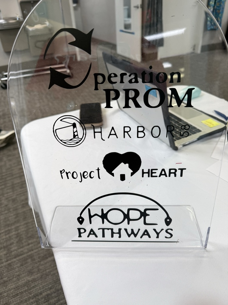 A sign with nonprofit organizations listed