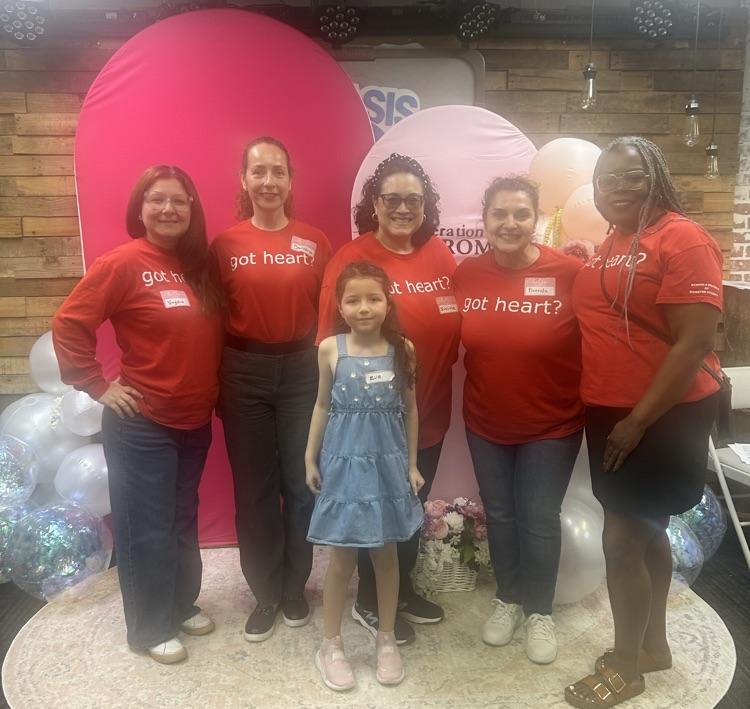 A group of volunteers wearing red T-shirts