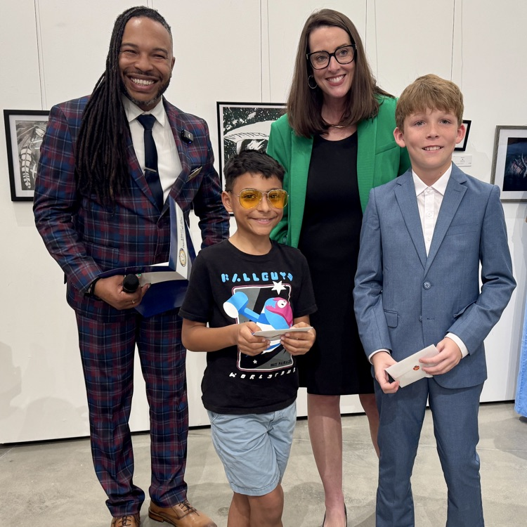 too young artist received an award at an art event