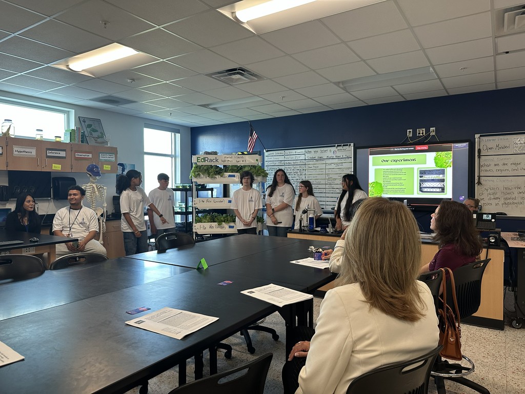 Students participating in a research presentation.