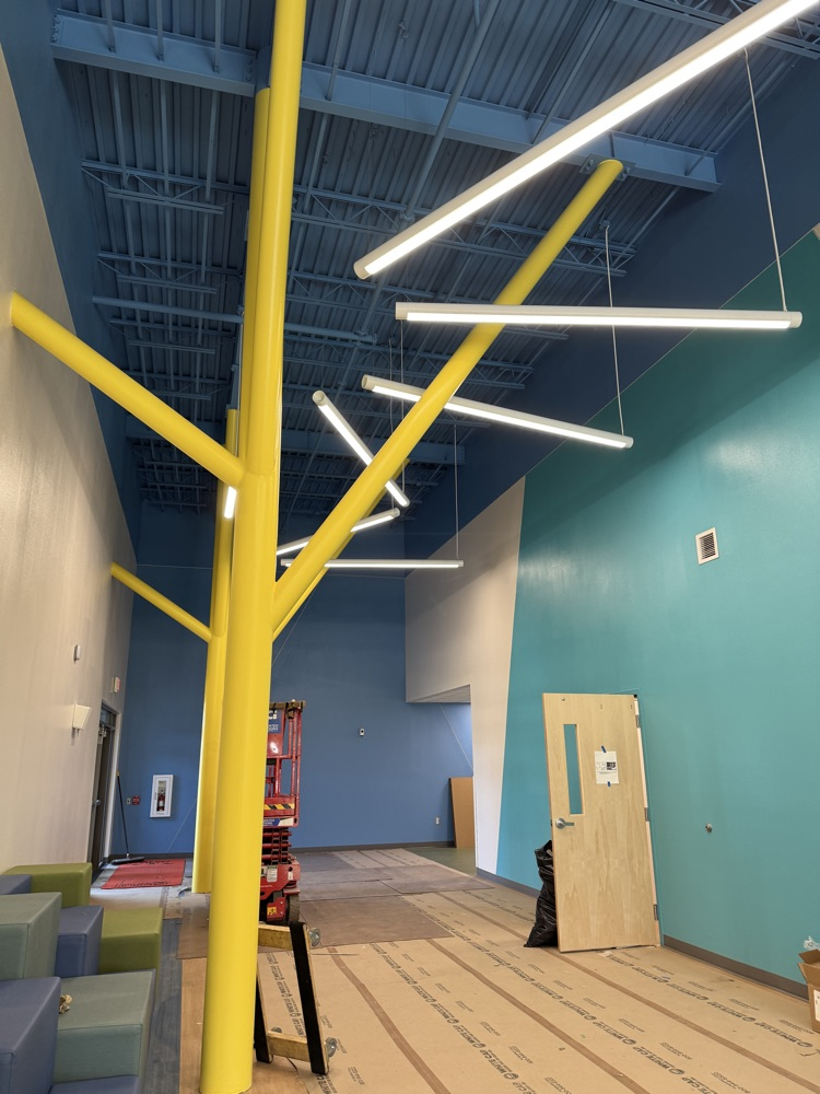 A yellow column in a brand new school building