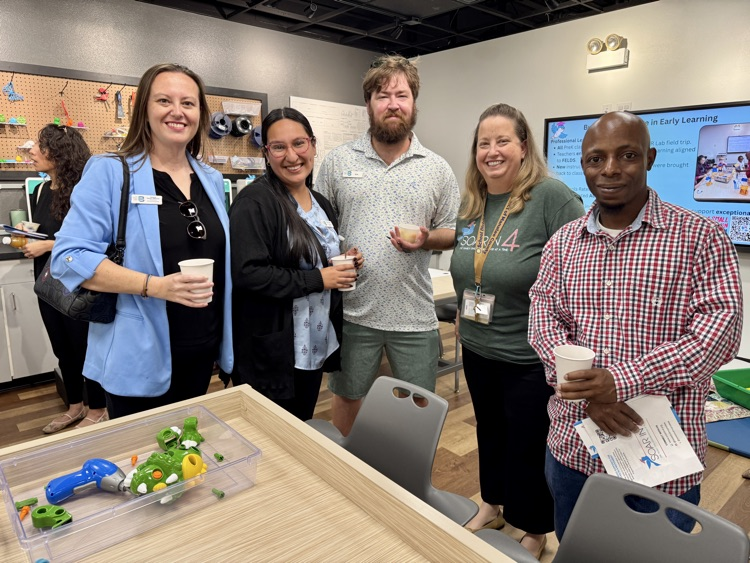 A group of museum, representatives and educators celebrate any special event