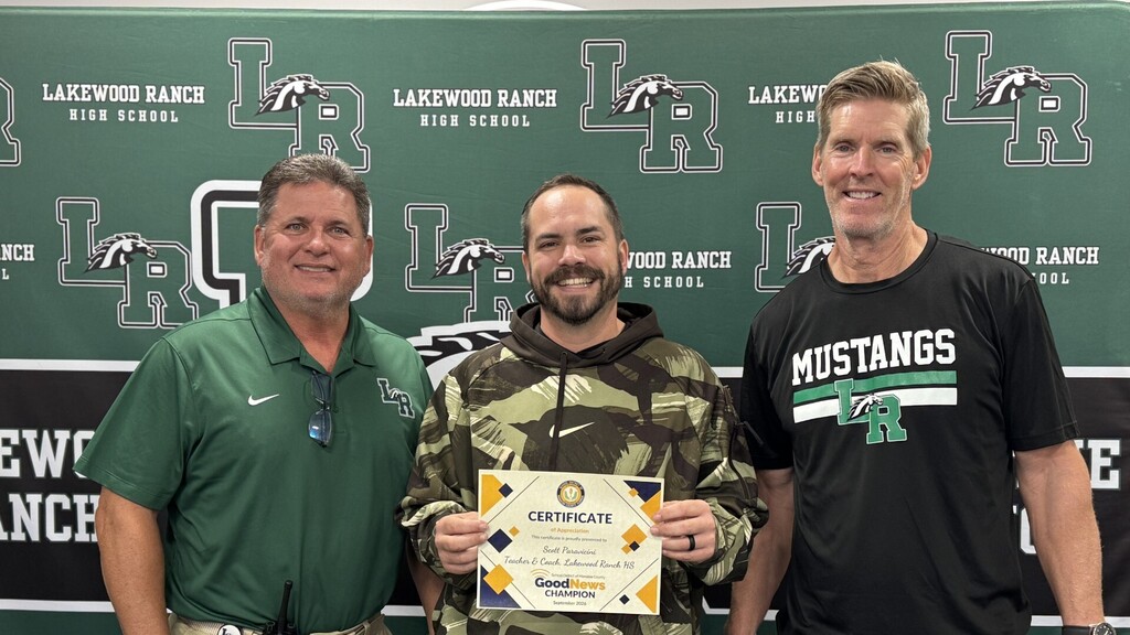 Three smiling men standing in front of a high school athletics wall for Lakewood Ranch