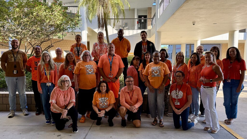 Middle school teachers and staff wearing orange as part of an anti-bullying campaign.
