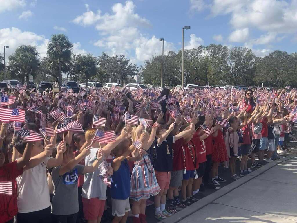 Students holding flags