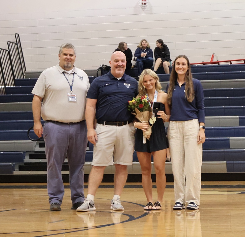 From left to right: Principal Daniel Bradshaw, Athletic Director Shawn Trent, Zoey Morelli, and Weight Lifting Coach Remi Hebert