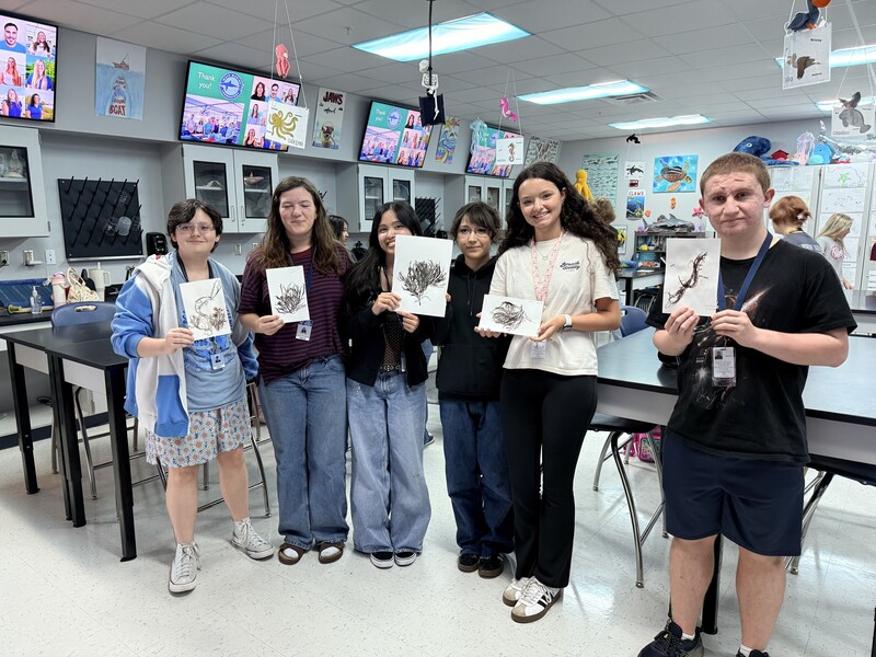 Marine Science students with algae prints from club meeting