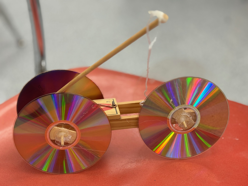 A similar mouse trap car using materials including CDs, string, and more.