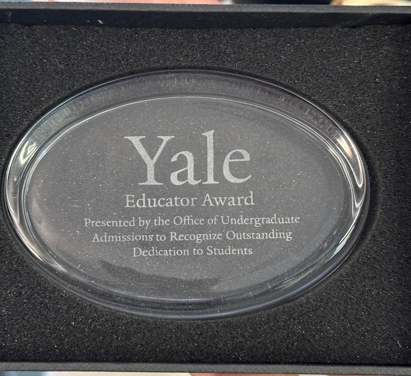 A Yale Educator Award paperweight