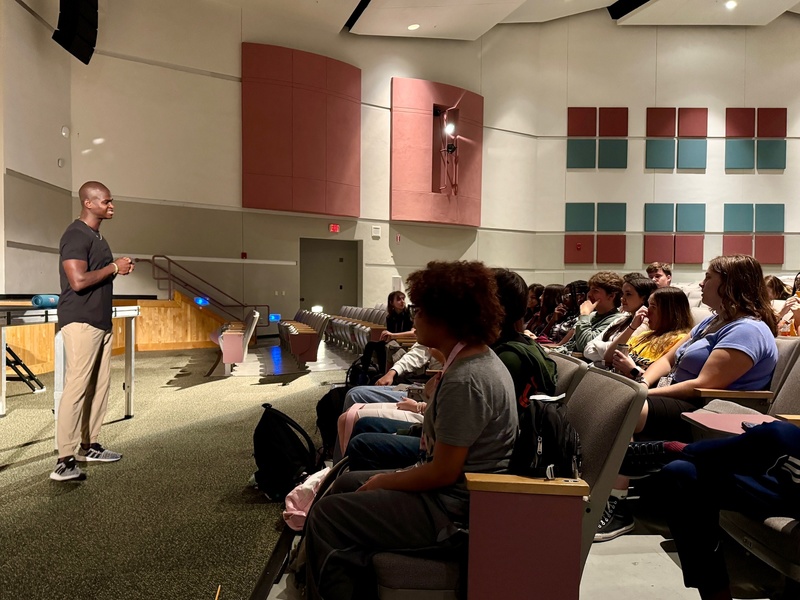 speaker and audience of high school students.