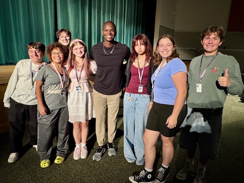 a group of performing arts students with a guest teacher