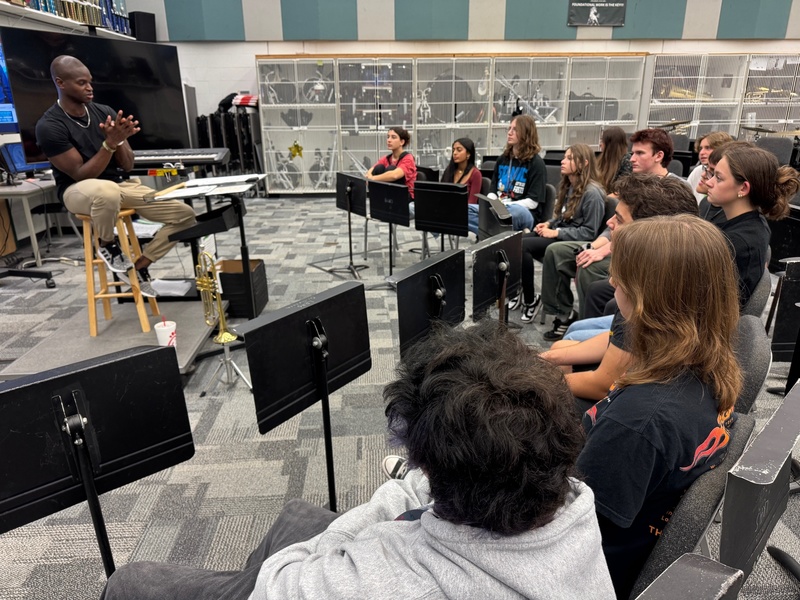 a special guest speaking to a high school jazz band.