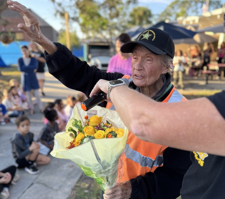crossing guard, Miss Maggie tells the entire school she loves them after they sing her happy birthday