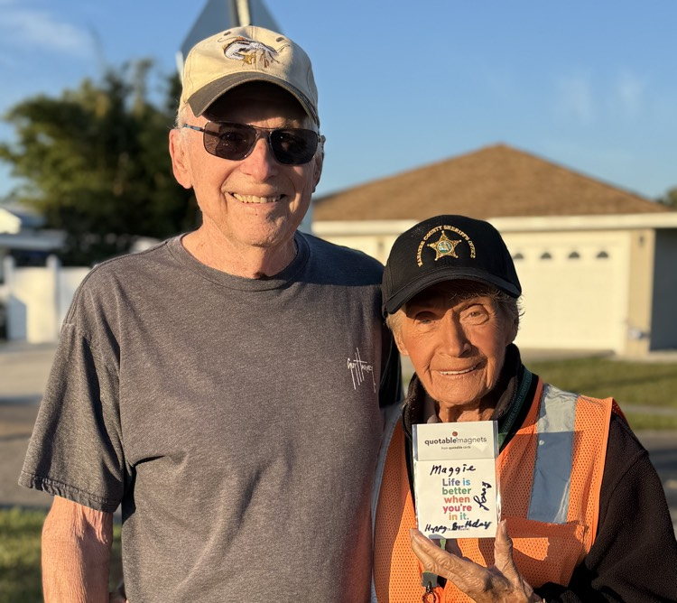 A Palma Sola resident stop to give the crossing guard a birthday gift