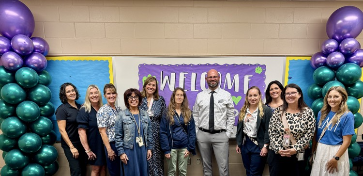 McNeil’s team leaders smile in a photo with Florida’s teacher of the year