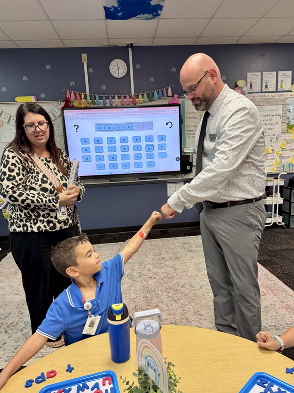 florida’s teacher of the year fist bumps a student