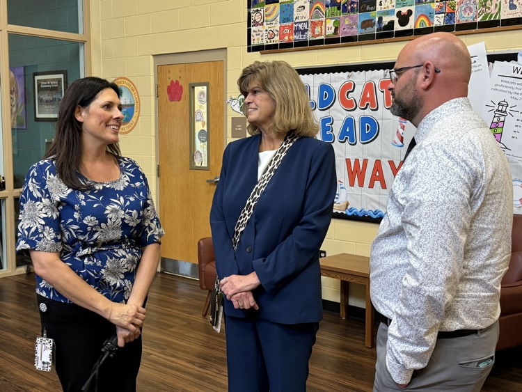 Florida’s teacher of the year along with a school principal and an employee who is the employee representing their school