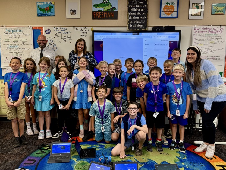 A class photo with third graders and their teachers