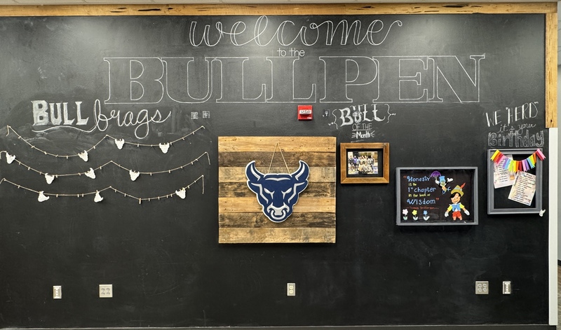 The Bull Pen wall boasting about recognitions and brags on a high school campus.