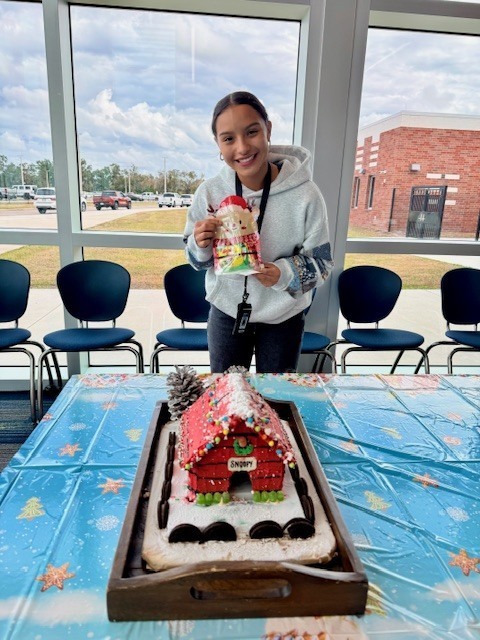 Rivera and her Charlie Brown Christmas Gingerbread House
