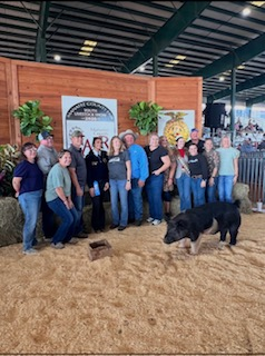 Group photos of buyers of the PCHS FFA animals presented at the fair.