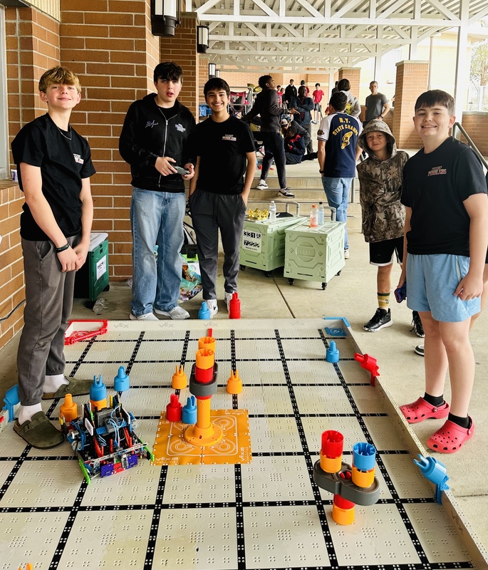 students with a vex robotics field.