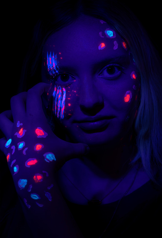 Avery Scribner's art piece with neon face paint