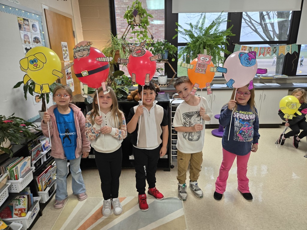 students holding balloon creations