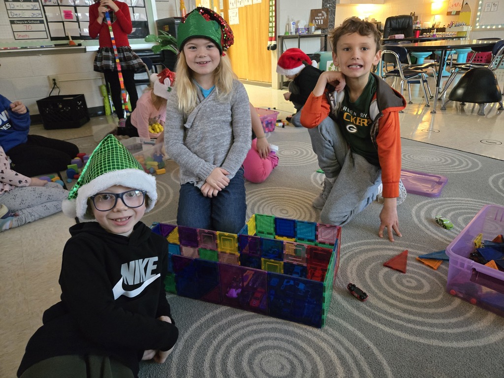 students building with magnet tiles