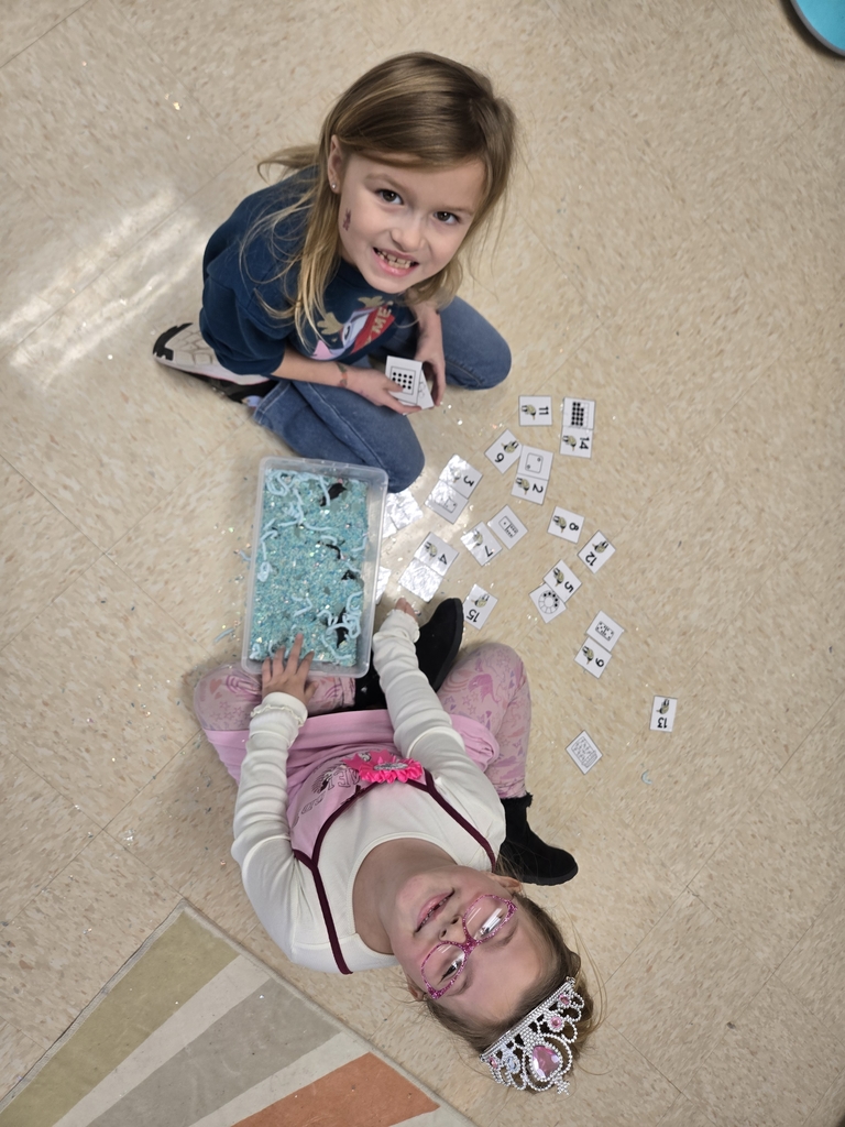 students exploring sensory bins