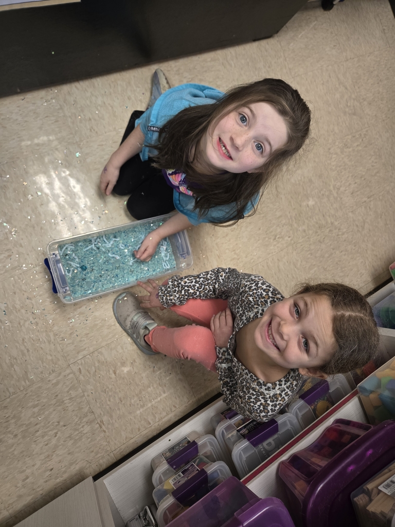 students exploring sensory bins