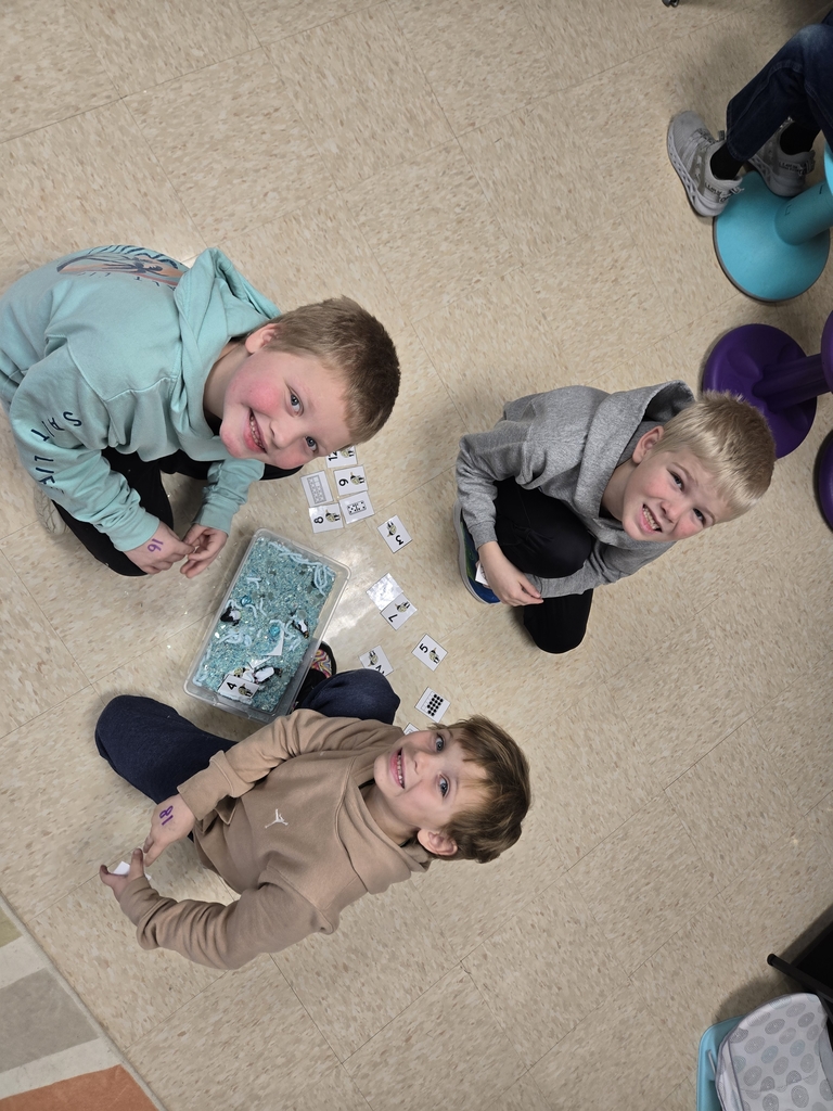 students exploring sensory bins