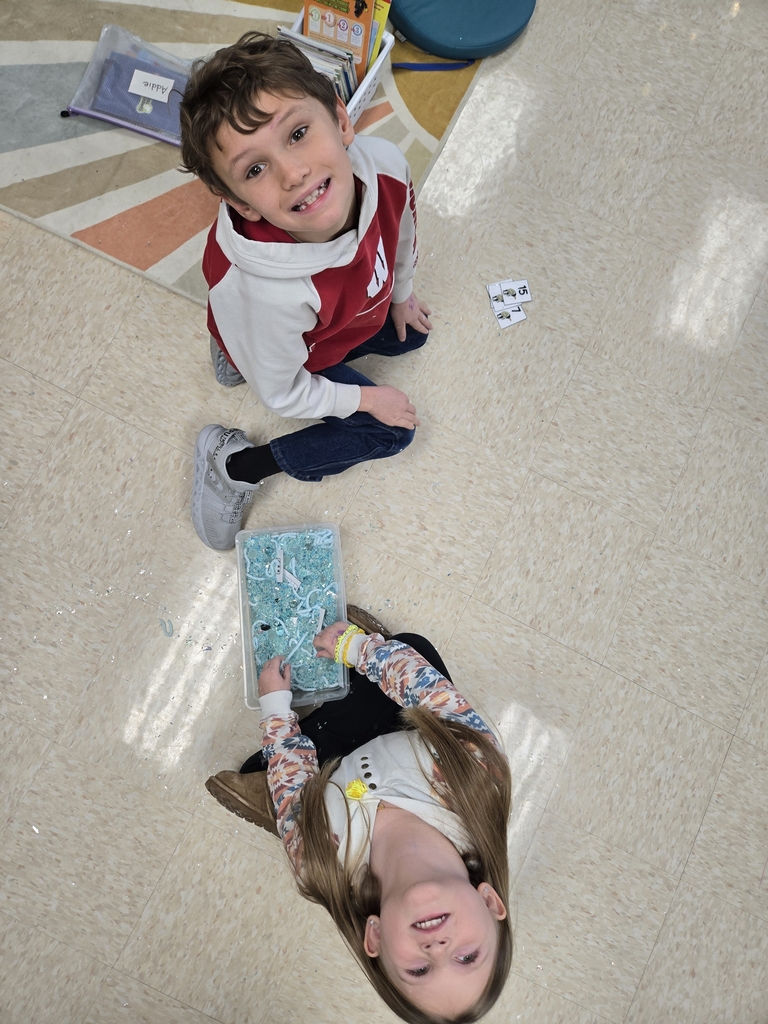 students exploring sensory bins