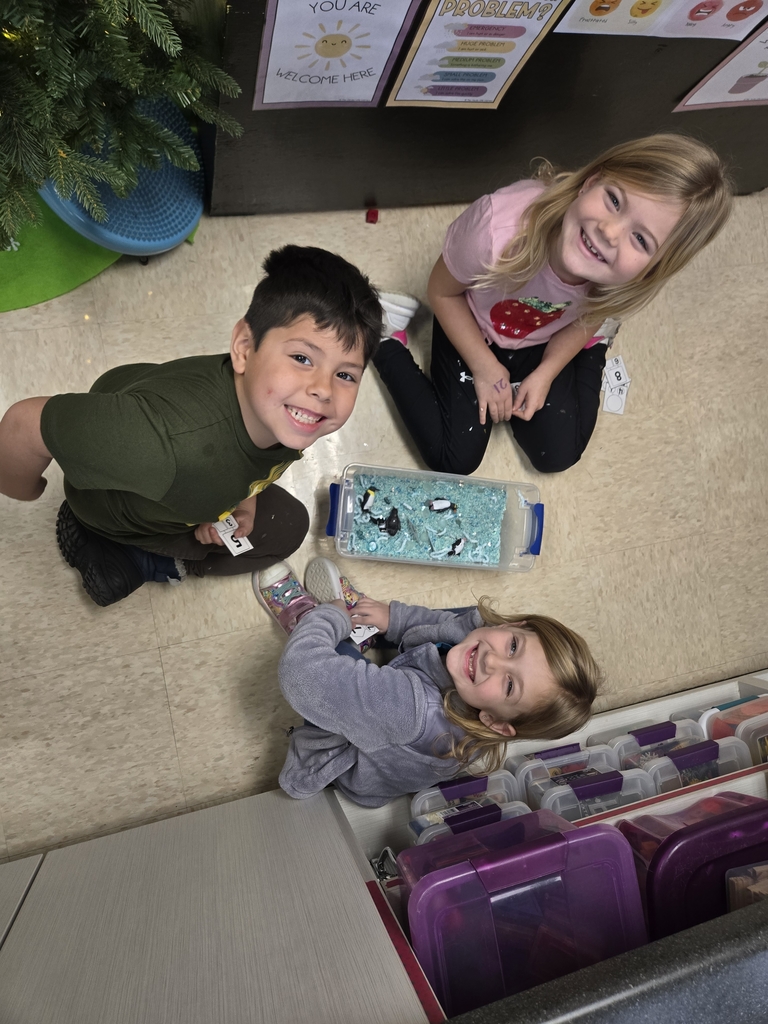 students exploring sensory bins