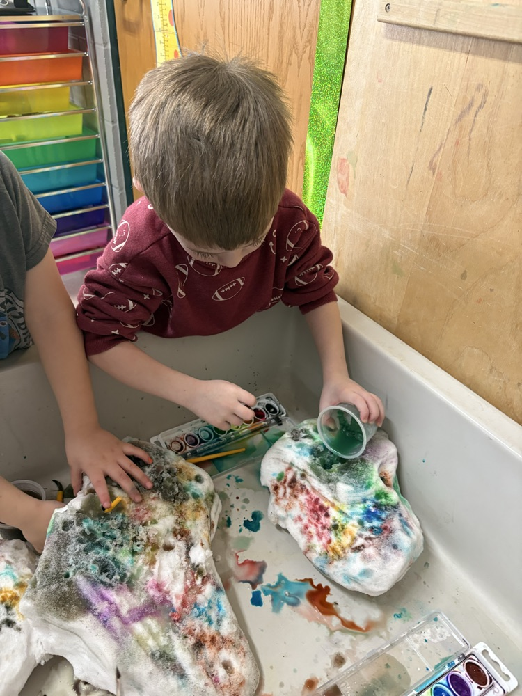 Too cold to play outside so Ms. Falkner brought snow inside.🎨❄️🐵