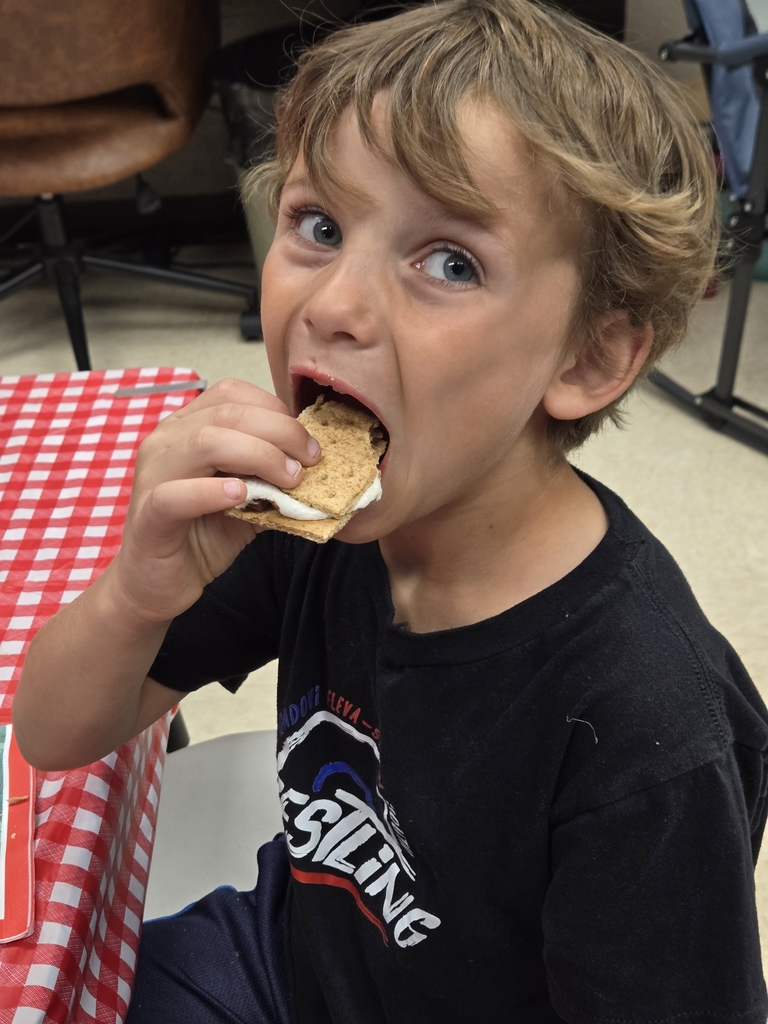 student eating s'more