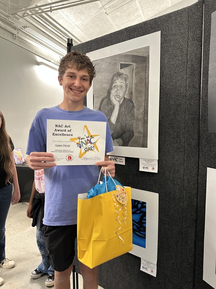 cooper p in front of his art show picture