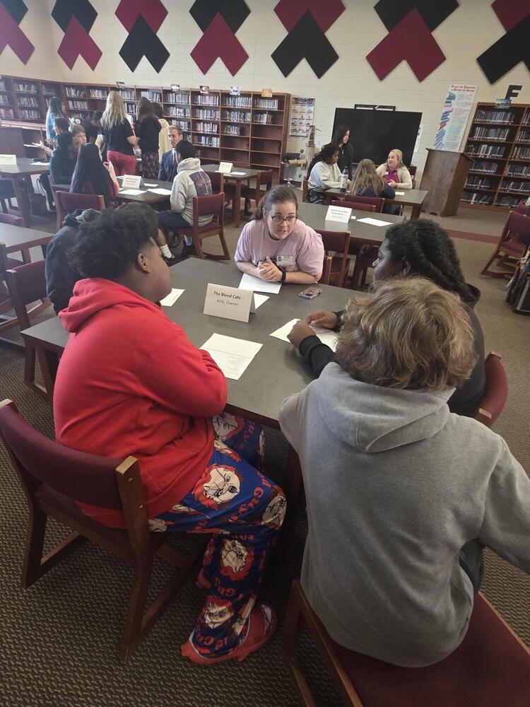 Students talking to a career professional about their career path at the Fall 2026 Human Library