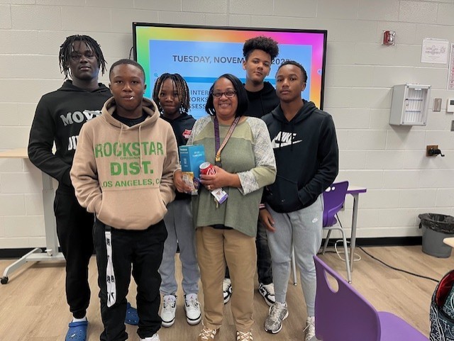 Anita Basnight and 8th grade students