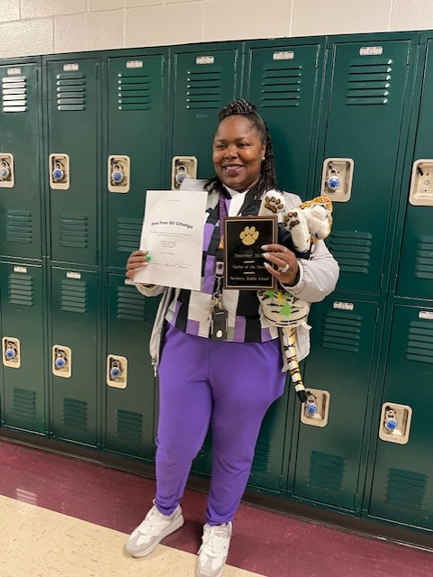 Pictured: Crystal Boyd with "Teddy the Tiger" (Teacher Mascot) -Plaque for December 2025 Teacher of the Month and her Stokes Trainor 27 point inspection & FREE Oil Change compliments of Joe Trainor, Owner/Operator of Stokes Trainor (Thank you to Mr. Trainor and the Stokes Trainor Dealership for your continued support & partnership with Newberry Middle School) 
