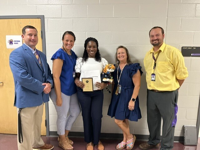 Picture 5: Left to Right -Mr. Zeb Reid (Principal, Dr. Tonya Deese-Jeter (AP), Mrs. Geron Wiggins-August 2026 Teacher of the Month (7th ELA/8th ELA), Mrs. Ruth Ransdell (API), and Mr. Douglas Ard (AP)