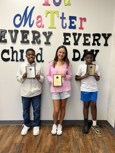 Picture 1: Left to Right-*Students of the Month Charles Johnson (6th), Amelia Wainwright (7th), and Anthony Wise, Jr. (8th)