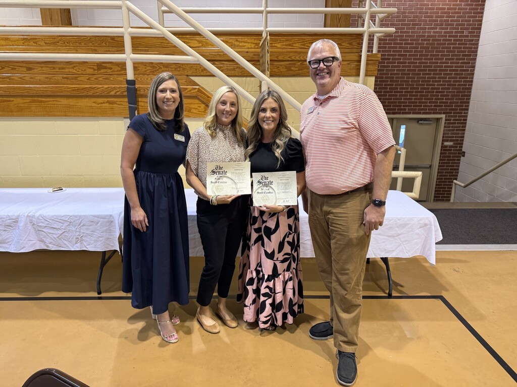 Four Boundary Street Elementary staff members pose at the district’s Celebration of Educational Excellence. Coach Reid and Nurse Brandi stand in the center holding certificates, with Principal Mrs. Fore on the left and Assistant Principal Mr. Dukes on the right.