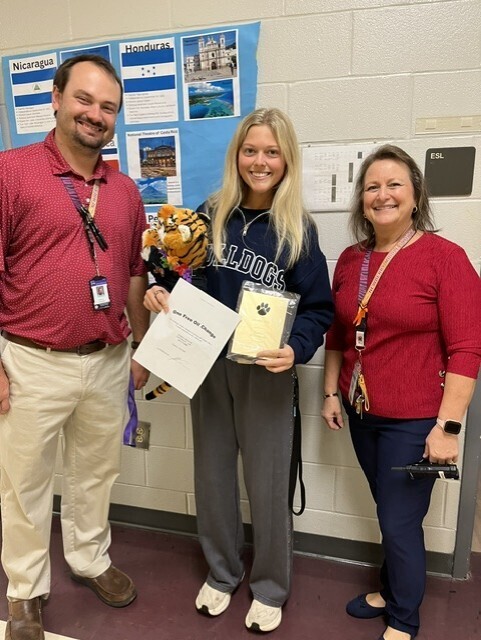 Teacher of the Month: Dantzler Long (October 2026) Pictured: Left to Right: Mr. Ard, Coach Long, and Mrs. Ransdell