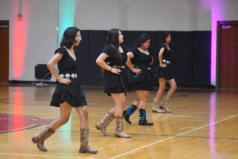 Students doing a showcase dance of dances popular in Hispanic countries
