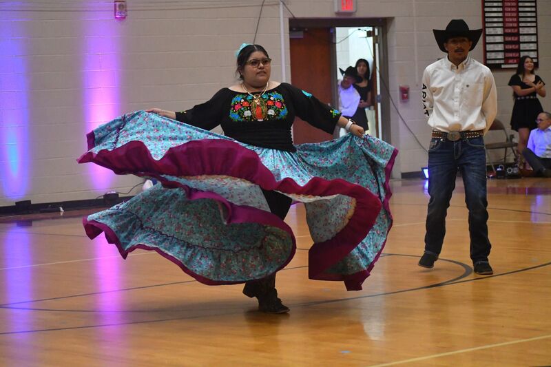 Student dancing a traditional Hispanic dance with a flowing skirt