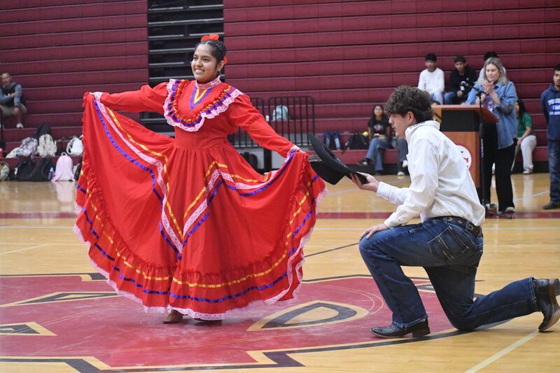 Student dancing a traditional Hispanic dance with a flowing skirt