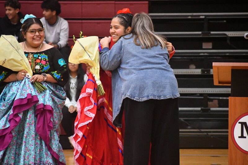 Students receiving flowers from Ms. Carpenter
