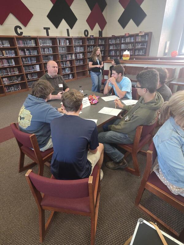 Students talking to a career professional about their career path at the Fall 2026 Human Library